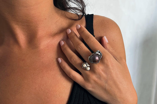 Close-up of a woman's hand wearing multi pearl sterling silver ring